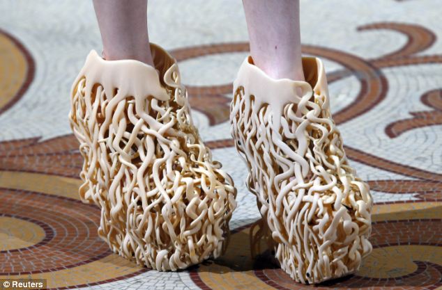 Well-rooted: Inspired by &apos;wild nature&apos;, Dutch fashion designer Iris van Herpen showcased shoes that looked like works of abstract sculpture for her Haute Couture Fall 2013 collection in Paris